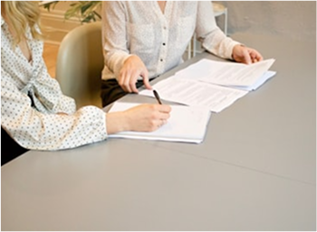 Person writing financial plan